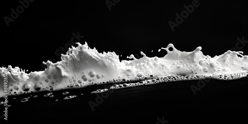 Black and white photo of foamy water waves