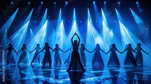 During a high-energy dance performance, a lighting designer manages a complex array of moving lights and strobes. The choreography of lights mirrors the dancers' movements, adding an extra layer of