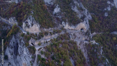 Aerial view of scenic Piva Lake with majestic mountains and winding road, Pluzine, Montenegro.