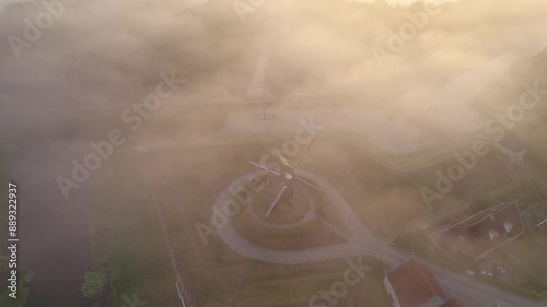 Aerial view of historic fortress, windmill, and fog in Bourtange, Groningen, Netherlands. photo