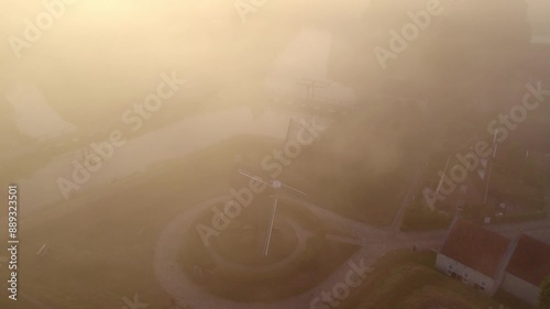 Aerial view of foggy sunrise over windmill village, Bourtange, Netherlands. photo