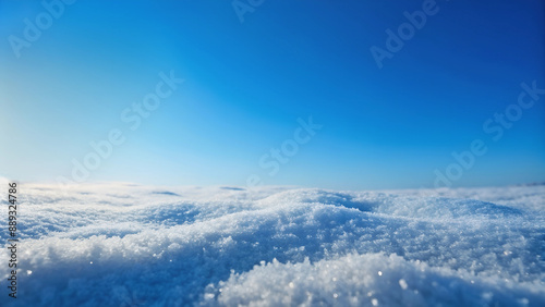 Snowy scene from high point against blue sky backdrop