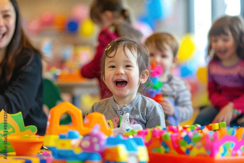 A cheerful and laughing child is deeply engaged with a set of colorful preschool toys, surrounded by friends and a lively, bright classroom creating a joyful atmosphere.