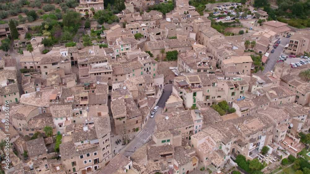 Aerial view of picturesque mountain village with stone houses and rustic rooftops, Fornalutx, Mallorca, Spain. Aerial view of picturesque mountain village with stone houses and rustic rooftops, Fornalutx, Mallorca, Spain.
