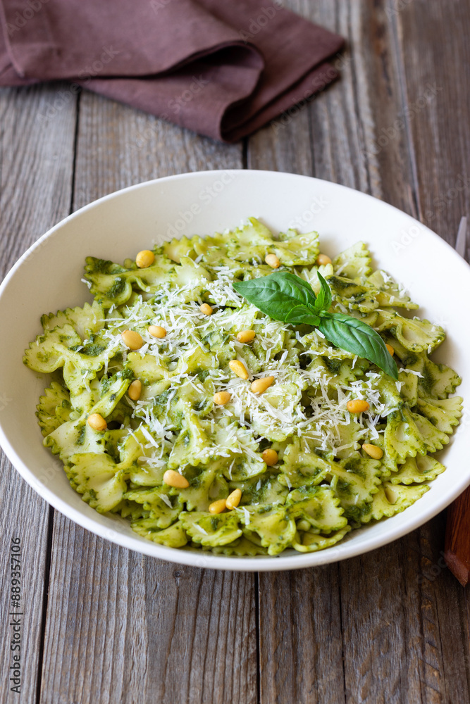Farfalle pasta with pesto sauce. Healthy eating. Vegetarian food. Farfalle pasta with pesto sauce. Healthy eating. Vegetarian food.