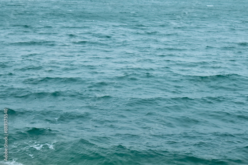 Sea water surface, wave texture. Calm seascape. The background of the blue waters of the sea. Background sea calm water.