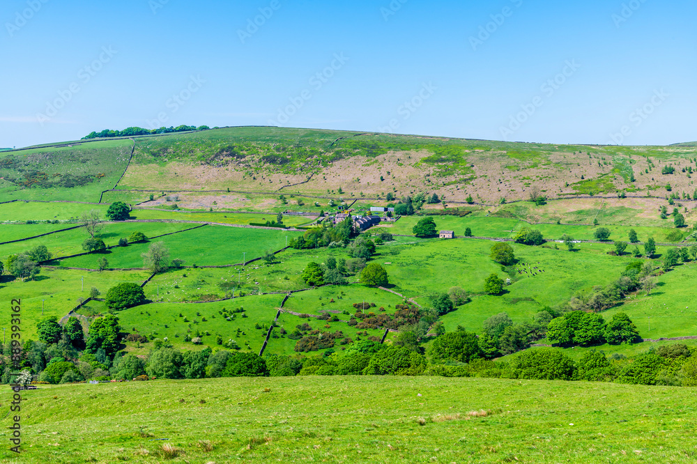 A rural view across the dales towards farmland from the path leading to Luds Church in Staffordshire in summertime A rural view across the dales towards farmland from the path leading to Luds Church in Staffordshire in summertime