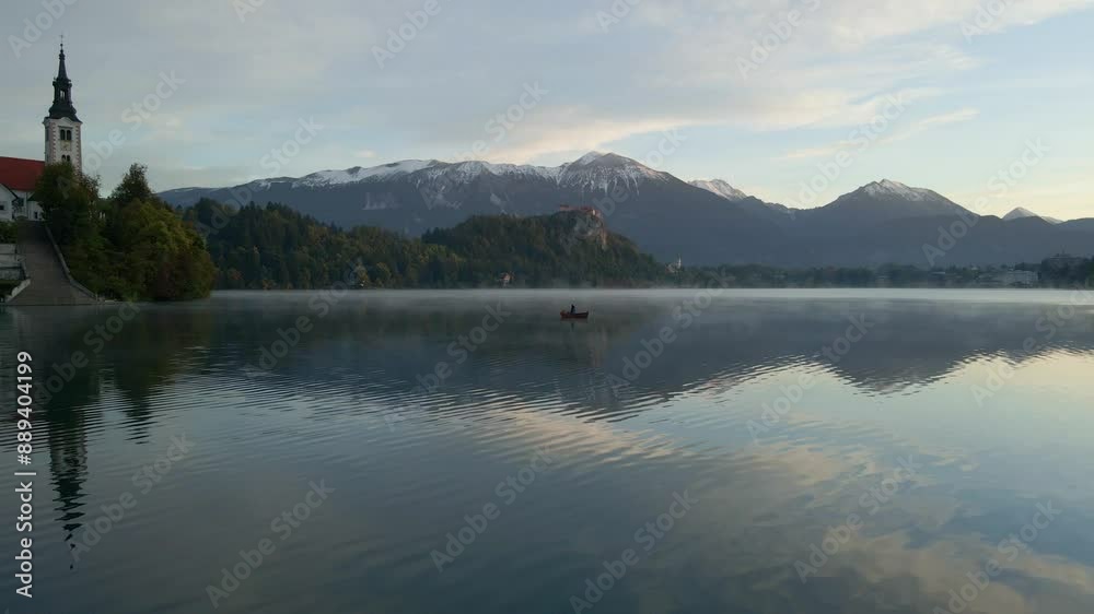 Aerial view of Lake Bled with Church and Island in foggy sunrise, Julian Alps, Slovenia. Aerial view of Lake Bled with Church and Island in foggy sunrise, Julian Alps, Slovenia.