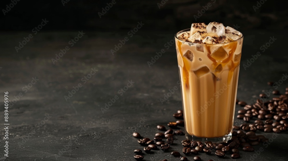 Iced coffee with cream, ice cubes, and beans in a tall glass on a dark concrete surface, set against a black backdrop with cup Iced coffee with cream, ice cubes, and beans in a tall glass on a dark concrete surface, set against a black backdrop with cup