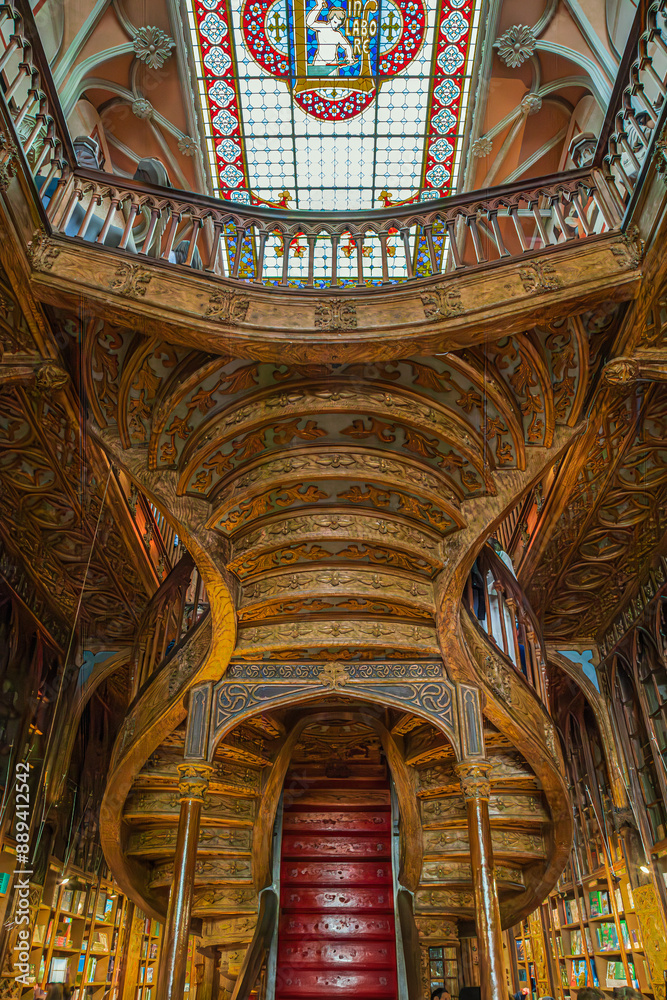Fototapeta premium Interior of the Livraria Lello e Irmao, known as the Lello Bookshop, oldest in Portugal, dated from 1891, famous for Harry Potter film.Sumptuous interior wood staircase.Porto, Portugal