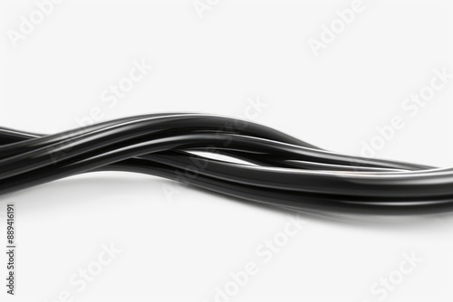 A close-up shot of a black hose resting on a white surface, ideal for use in product photography or as a design element