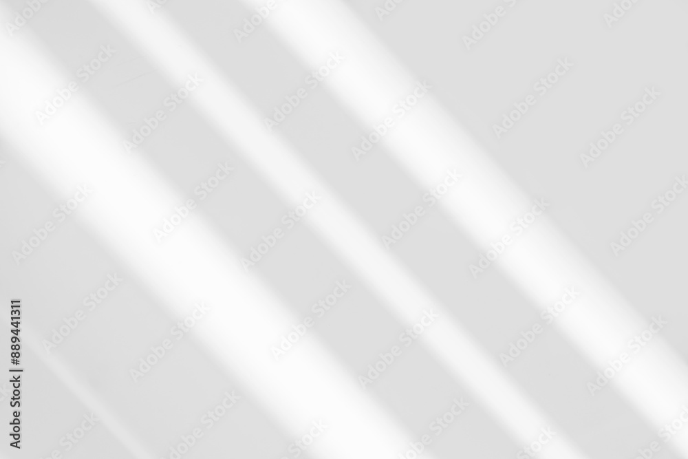 Abstract light reflection and grey shadow from window on white wall background. Gray stripe window shadows and sunshine diagonal geometric overlay effect for backdrop and mockup design Abstract light reflection and grey shadow from window on white wall background. Gray stripe window shadows and sunshine diagonal geometric overlay effect for backdrop and mockup design