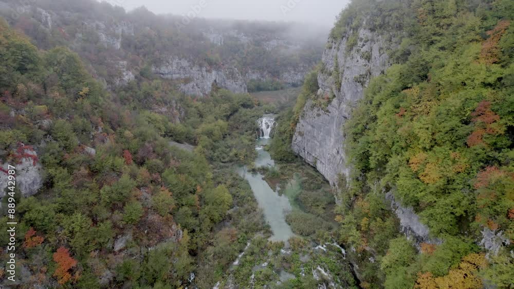 Aerial view of misty waterfall and serene lake in Plitvice, Croatia. Aerial view of misty waterfall and serene lake in Plitvice, Croatia.
