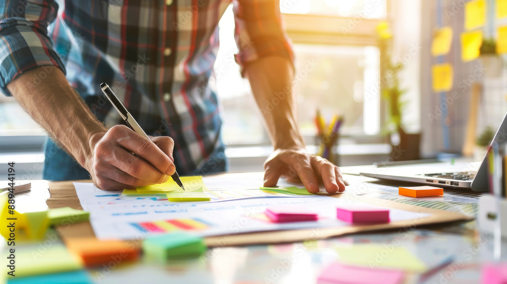 A person actively designs and plans using colorful post-its at a bright workspace, embodying brainstorming, creativity, and thoughtful organization. A person actively designs and plans using colorful post-its at a bright workspace, embodying brainstorming, creativity, and thoughtful organization.