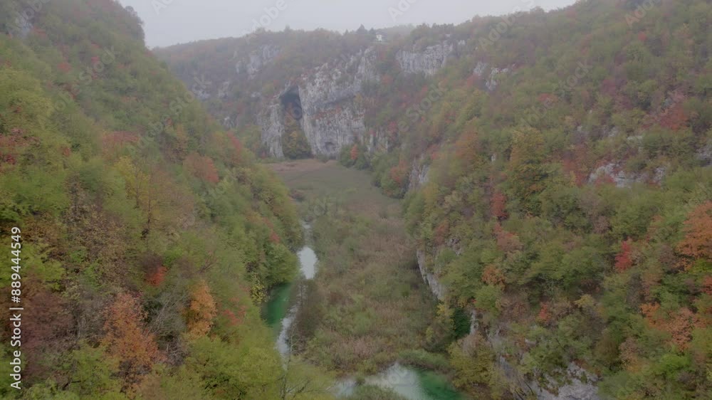 Aerial view of majestic waterfall in serene forest valley, Plitvice, Croatia. Aerial view of majestic waterfall in serene forest valley, Plitvice, Croatia.