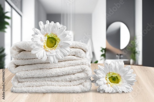 Set of fresh towels on desk in bathroom.