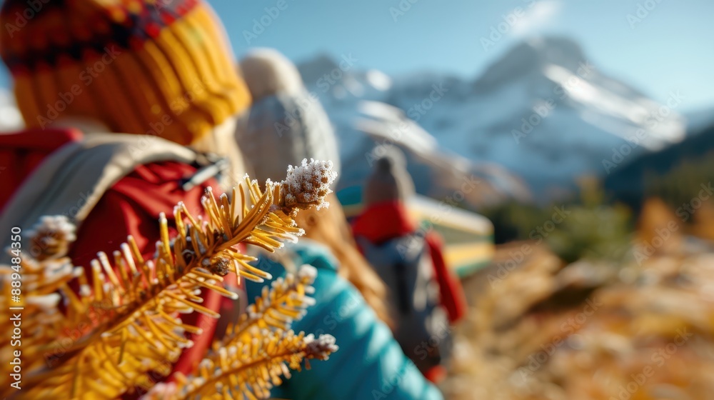 Fototapeta premium A group of hikers, dressed in colorful winter gear, make their way through a stunning snowy mountain landscape, showcasing both the beauty and challenge of winter exploration.