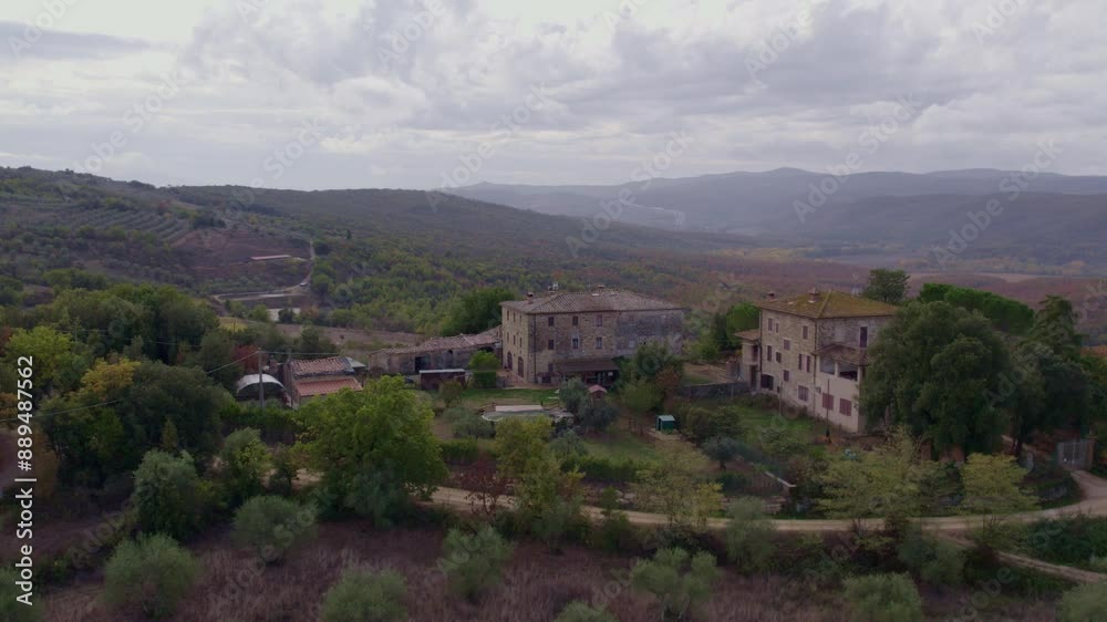 Aerial view of tranquil countryside with olive trees and rustic houses, Murlo, Tuscany, Italy. Aerial view of tranquil countryside with olive trees and rustic houses, Murlo, Tuscany, Italy.