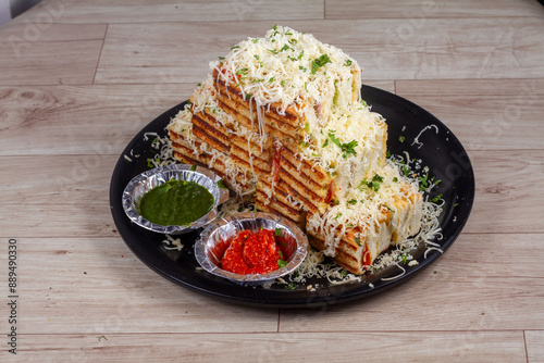 Veg grilled sandwich served with ketchup, isolated over a rustic wooden background, selective focus