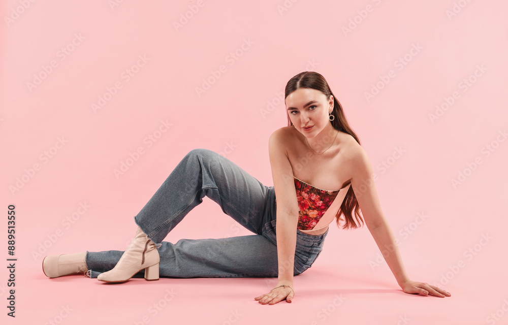 Beautiful woman in stylish corset posing on pink background Beautiful woman in stylish corset posing on pink background