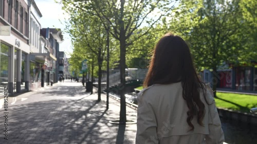 Zaandam, Netherlands. A girl walks down the street during sunset