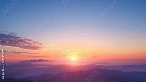 Beautiful sunrise over misty mountains with vibrant colors of dawn, the natural beauty and tranquility of nature.