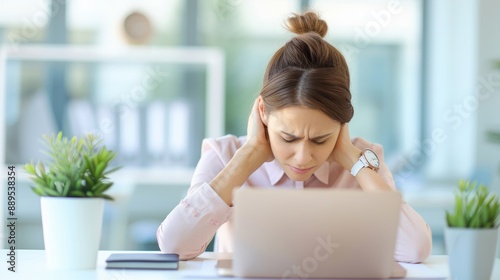 A man is sitting at a desk with a laptop and a potted plant Free Download A man is sitting at a desk with a laptop and a potted plant - GFXLoad