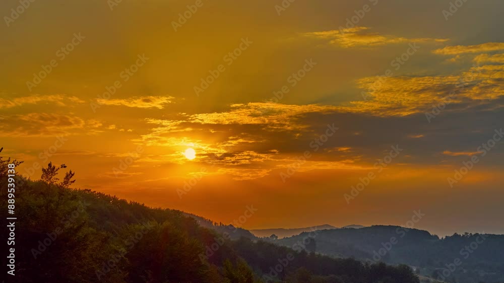 Nature landscape sunset cumulus clouds rolling over hills and mountains time-lapse
