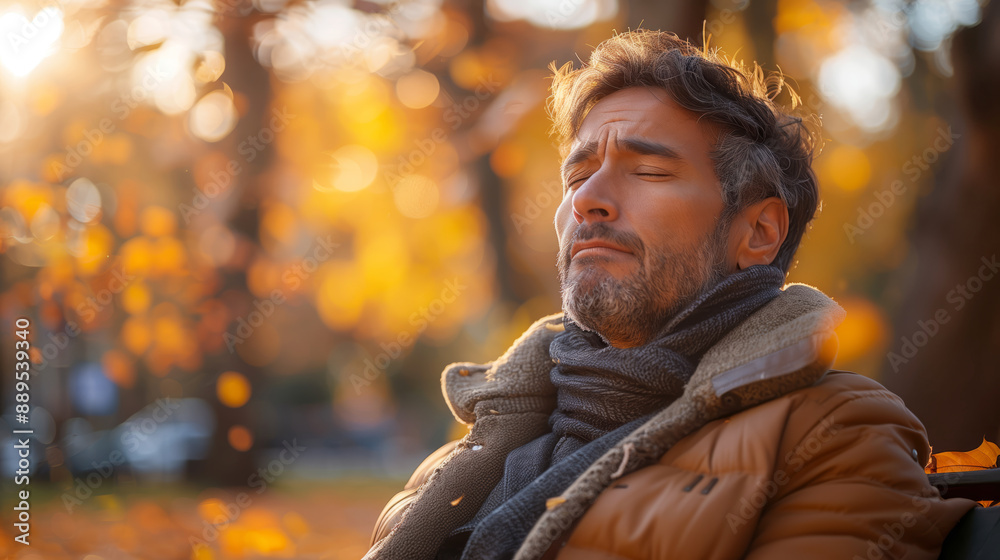 A man sitting on a bench in an autumn park, his eyes closed as he gently sways his head from side to side while breathing deeply A man sitting on a bench in an autumn park, his eyes closed as he gently sways his head from side to side while breathing deeply