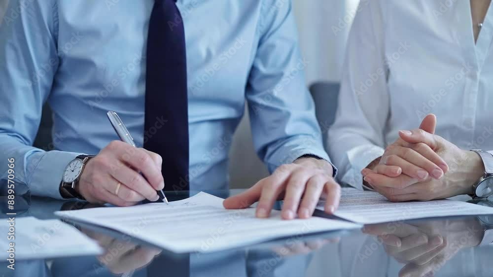 Business people signing important documents during a corporate meeting. Win-win concept for diverse team group