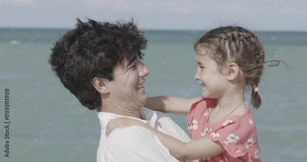 Father and daughter having fun on the beach Father and daughter having fun on the beach