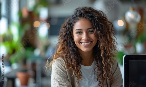 Portrait of Enthusiastic Hispanic Young Woman Working on Computer in a Modern Bright Office. Confident Human Resources Agent Smiling Happily While Collaborating Online with, Generative AI