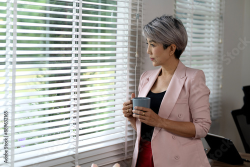 senior businesswoman In casual clothes he is holding a coffee mug Free Download senior businesswoman In casual clothes he is holding a coffee mug - GFXLoad
