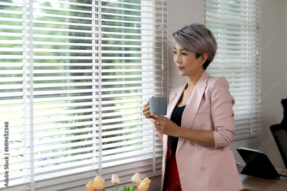 senior businesswoman In casual clothes he is holding a coffee mug senior businesswoman In casual clothes he is holding a coffee mug