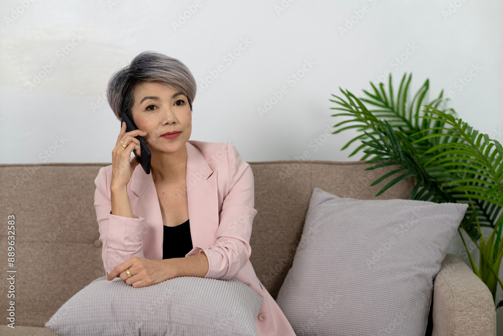 female executive is comfortable and happy using the phone female executive is comfortable and happy using the phone