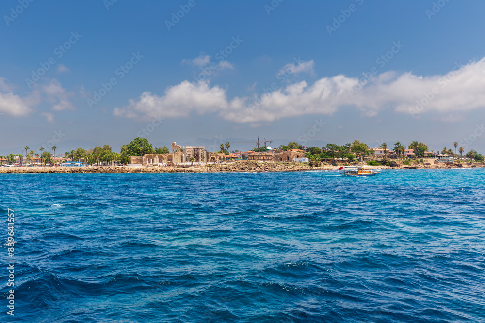 Naklejka premium View from the sea to the historic town of Side and ruins of Apollo temple in Turkey