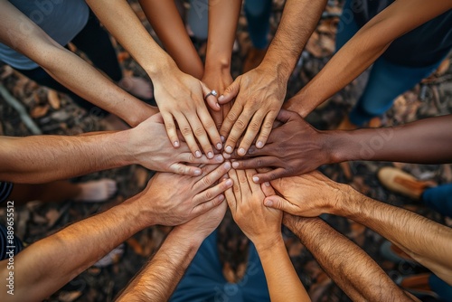 Diverse hands in unity. Different ethnic hands joined together in a circle, symbolizing unity, teamwork, and diversity. Ideal for community, collaboration, and social cohesion concepts.