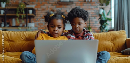 Two Children Watching Laptop on Couch in Living Room