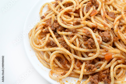 Italian pasta with meat on a white plate. Noodles with meat.