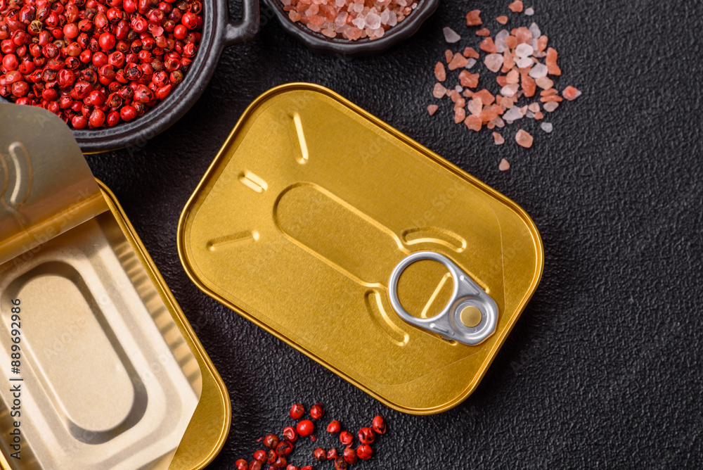 Metal can with canned meat or fish with a key to open it
