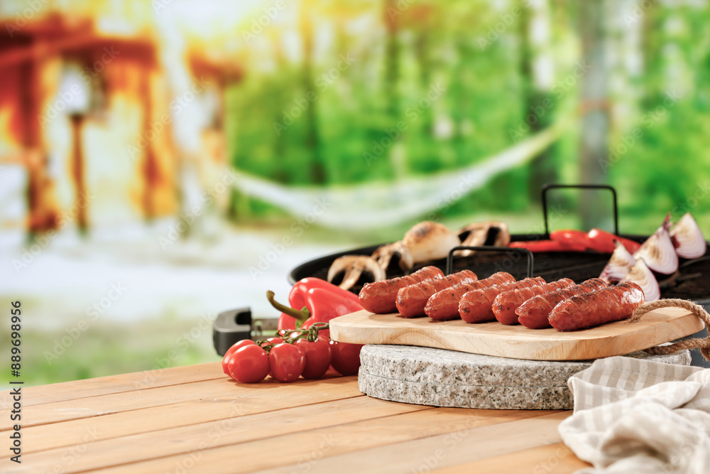 Φωτογραφία Wooden garden table and grilled sausages and vegetables in  summer time concept and copy space for food and products