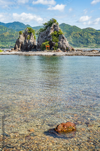 Isolated shinto shrine on Bentenjima island in Nachikatsuura, Japan. Scenic rocky landscape from the Pacific coast photo