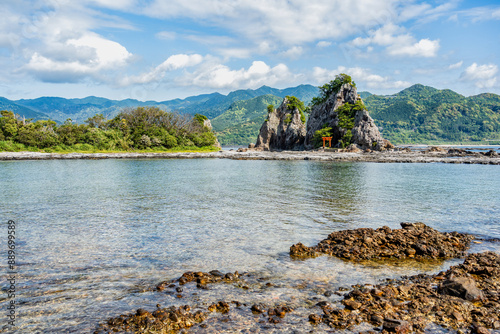 Isolated shinto shrine on Bentenjima island in Nachikatsuura, Japan. Scenic rocky landscape from the Pacific coast photo