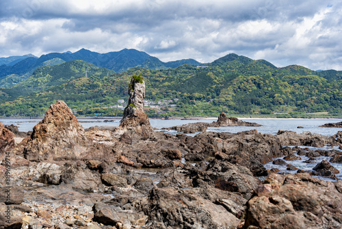 Dramatic rock formations on the coast of Pacific Ocean in Nachikatsuura, Wakayama, Japan, part of the Yoshino-Kumano National Park and Nanki Kumano geopark. photo