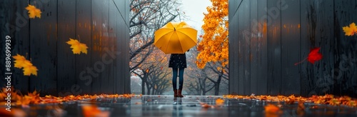 Woman Walking With Yellow Umbrella in Autumn Rain