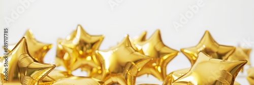 Closeup of a group of gold star-shaped balloons on a white background