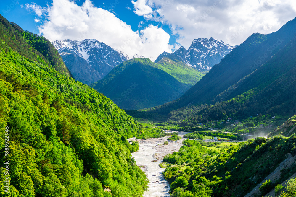 Naklejka premium Beautiful view of the valley of the mountain river among the high mountains. The North Caucasus. Russia