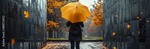 Woman Walking With Yellow Umbrella in Autumn Rain