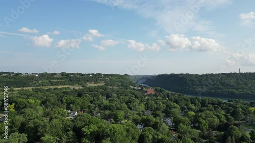 Aerial overlooking the Niagara River Escarpment from Lewiston in western New York, United States with the Queenston Lewiston international border crossing and Canada in the distance. July, 2024. photo