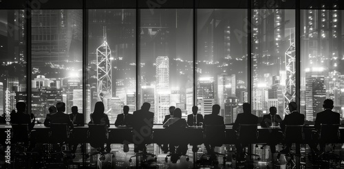 Business Meeting Silhouettes Against Nighttime City Skyline